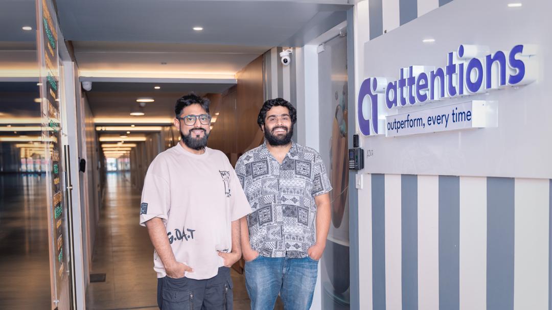 The founders at the Attentions office entrance