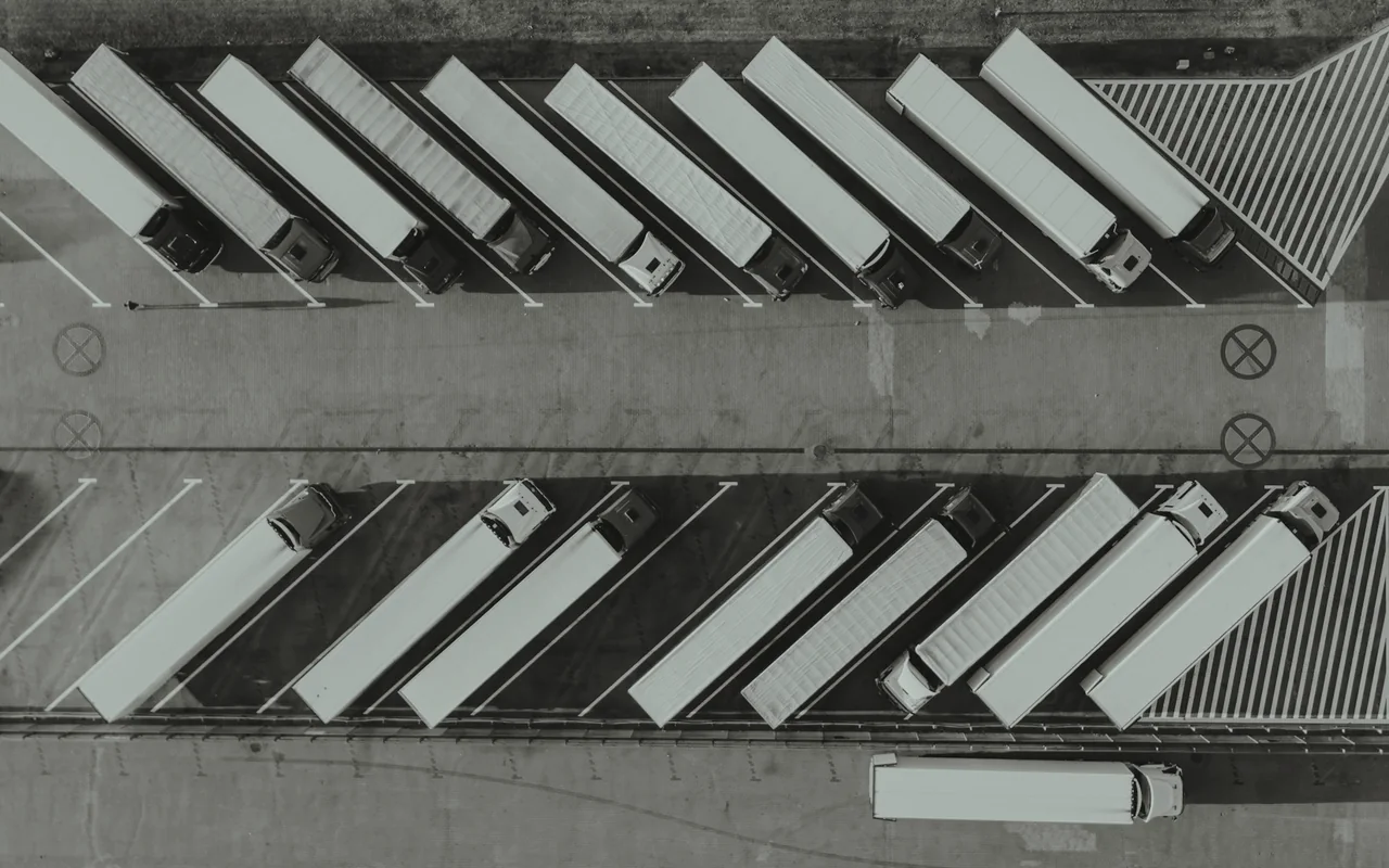 Trucks parked in rows, seen from above.