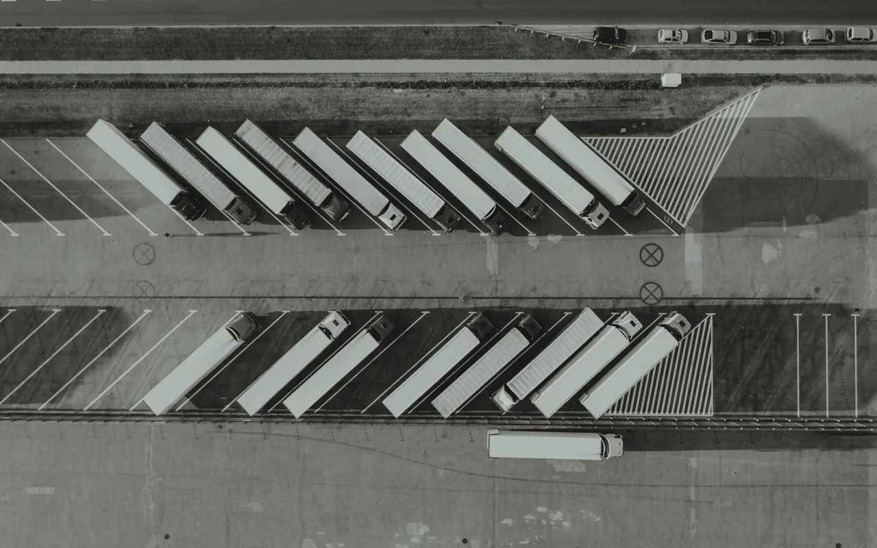 Two rows of parked trucks, seen from above.